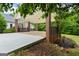 The carport area leads to lush greenery, enhancing the property's curb appeal at 333 Old Carrollton Rd, Roopville, GA 30170