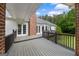 Spacious back deck area with a brick chimney, offering space for outdoor lounging and dining at 333 Old Carrollton Rd, Roopville, GA 30170