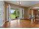 Sun-filled foyer with polished hardwood floors and elegant french doors opening to the outdoor deck and yard at 333 Old Carrollton Rd, Roopville, GA 30170