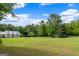 Beautifully manicured front lawn with a charming home in the background, perfect for outdoor enjoyment at 333 Old Carrollton Rd, Roopville, GA 30170