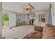 Inviting living room with carpet, a door to the outside, and an opening to the kitchen at 333 Old Carrollton Rd, Roopville, GA 30170
