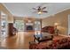 Spacious living room featuring a cozy fireplace, hardwood floors, and access to the outdoor patio at 333 Old Carrollton Rd, Roopville, GA 30170