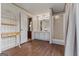 Main bathroom boasts double vanity, wood flooring, and step in shower at 333 Old Carrollton Rd, Roopville, GA 30170