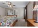 Spacious main bedroom with ceiling fan, en-suite bathroom, and a comfortable wooden bed frame at 333 Old Carrollton Rd, Roopville, GA 30170