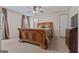 Comfortable main bedroom with carpet, ceiling fan, and natural light at 333 Old Carrollton Rd, Roopville, GA 30170