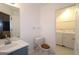 Bright bathroom with washer and dryer in an adjacent room at 5851 Giles Rd, Lithonia, GA 30058