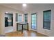 Dining area leading to a kitchen and a door to the outside at 5851 Giles Rd, Lithonia, GA 30058
