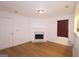 Cozy living room with a fireplace and wood floors at 5851 Giles Rd, Lithonia, GA 30058