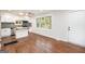 Cozy kitchen with white cabinets, stainless steel appliances, and a wooden countertop island at 2952 Diana Sw Dr, Atlanta, GA 30315