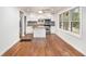 Open kitchen featuring white cabinets, an island, butcher block countertops, and stainless steel appliances at 2952 Diana Sw Dr, Atlanta, GA 30315
