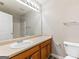 Bathroom with a single sink vanity, large mirror, and combination shower and tub at 1360 Maple Valley Ct, Union City, GA 30291