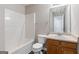 Bathroom featuring a single sink vanity with a combination shower and tub at 1360 Maple Valley Ct, Union City, GA 30291