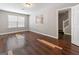 Spacious room with wood floors, neutral walls, and ample natural light, ideal for relaxation and personalization at 1360 Maple Valley Ct, Union City, GA 30291