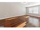 Bright, empty bedroom with wood floors and natural light from a window. Perfect for personalization at 1360 Maple Valley Ct, Union City, GA 30291
