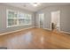 Bedroom with hardwood floors, natural light, closet, and bathroom access at 1360 Maple Valley Ct, Union City, GA 30291