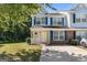 Charming two-story townhome with blue shutters and a well-maintained front yard, perfect for suburban living at 1360 Maple Valley Ct, Union City, GA 30291