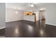 Open-concept living room with dark hardwood floors adjacent to the kitchen at 1360 Maple Valley Ct, Union City, GA 30291
