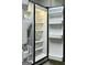 A view of the inside of a refrigerator with shelves and drawers at 1360 Maple Valley Ct, Union City, GA 30291