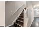 Carpeted staircase with white railing leading to the upper level of the home at 1360 Maple Valley Ct, Union City, GA 30291