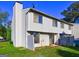 Back of townhome with small fenced patio area and vinyl siding at 288 Country Club Dr, Jonesboro, GA 30238