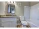 Bright bathroom featuring a granite vanity and tiled shower/tub at 288 Country Club Dr, Jonesboro, GA 30238