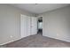 Carpeted bedroom with large closet and view to the outside at 288 Country Club Dr, Jonesboro, GA 30238