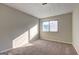 Neutral bedroom with carpeting, a large window, and natural light at 288 Country Club Dr, Jonesboro, GA 30238