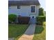 Charming townhome with manicured front yard and inviting walkway at 288 Country Club Dr, Jonesboro, GA 30238