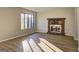 Inviting living room featuring hardwood floors and stone fireplace at 288 Country Club Dr, Jonesboro, GA 30238