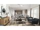 Open-concept living room with high ceilings, modern furniture, and access to the kitchen at 1205 Trombone Way # 3, Mcdonough, GA 30252