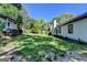 Lush backyard showing the house, screened porch, and surrounding greenery at 3336 Country Creek Nw Dr, Kennesaw, GA 30152