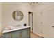 Well lit bathroom features modern vanity with gold fixtures and a round mirror at 3336 Country Creek Nw Dr, Kennesaw, GA 30152