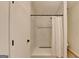 Modern bathroom with shower, glass door, and white tile at 3336 Country Creek Nw Dr, Kennesaw, GA 30152