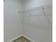 Walk-in closet with single shelf for optimal storage, on-trend paint and flooring at 3336 Country Creek Nw Dr, Kennesaw, GA 30152