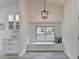 Bright dining area with custom cabinetry, window seat, modern light fixture, and contemporary design at 3336 Country Creek Nw Dr, Kennesaw, GA 30152
