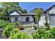 Front porch with beautiful landscaping and a comfortable seating area at 3336 Country Creek Nw Dr, Kennesaw, GA 30152