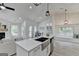 Open floor plan kitchen with granite counters, a stainless steel sink, and modern decor throughout at 3336 Country Creek Nw Dr, Kennesaw, GA 30152
