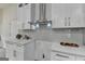 Modern kitchen featuring stainless steel appliances, granite countertops, and custom white cabinetry at 3336 Country Creek Nw Dr, Kennesaw, GA 30152