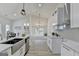 Bright kitchen with stainless steel appliances, granite countertops, and an adjacent dining area at 3336 Country Creek Nw Dr, Kennesaw, GA 30152