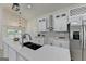 Bright kitchen with stainless steel appliances, granite countertops, and an adjacent dining area at 3336 Country Creek Nw Dr, Kennesaw, GA 30152