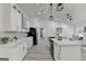 Spacious kitchen with granite counters, black appliances, and modern overhead lighting at 3336 Country Creek Nw Dr, Kennesaw, GA 30152