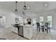 Open floor plan showing the kitchen, dining area, fireplace, and living room with modern decor at 3336 Country Creek Nw Dr, Kennesaw, GA 30152
