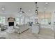Open-concept living room features a fireplace, dining area, kitchen island, and lots of natural light at 3336 Country Creek Nw Dr, Kennesaw, GA 30152