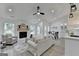 Bright living room with a fireplace, dining area, and open floor plan at 3336 Country Creek Nw Dr, Kennesaw, GA 30152