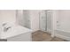 Spacious bathroom with double sinks, shower, and soaking tub at 100 Silver Moon Dr, Loganville, GA 30052