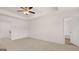 Spacious bedroom with carpet, ceiling fan, and access to a bathroom at 100 Silver Moon Dr, Loganville, GA 30052