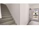 Entryway with stairway and front door view of the home's exterior at 100 Silver Moon Dr, Loganville, GA 30052