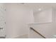 Light and bright hallway with a wooden railing and access to bedrooms at 100 Silver Moon Dr, Loganville, GA 30052