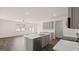 Modern kitchen featuring a large island, stainless steel appliances, and hardwood floors at 100 Silver Moon Dr, Loganville, GA 30052