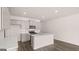 Modern kitchen features stainless appliances, subway tile backsplash, and a large island at 100 Silver Moon Dr, Loganville, GA 30052